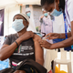 NAIROBI, KENYA - 2022/02/03: A healthcare worker administers Pfizer vaccine to a resident of Dagoretti in Nairobi during a mass vaccination drive countrywide.